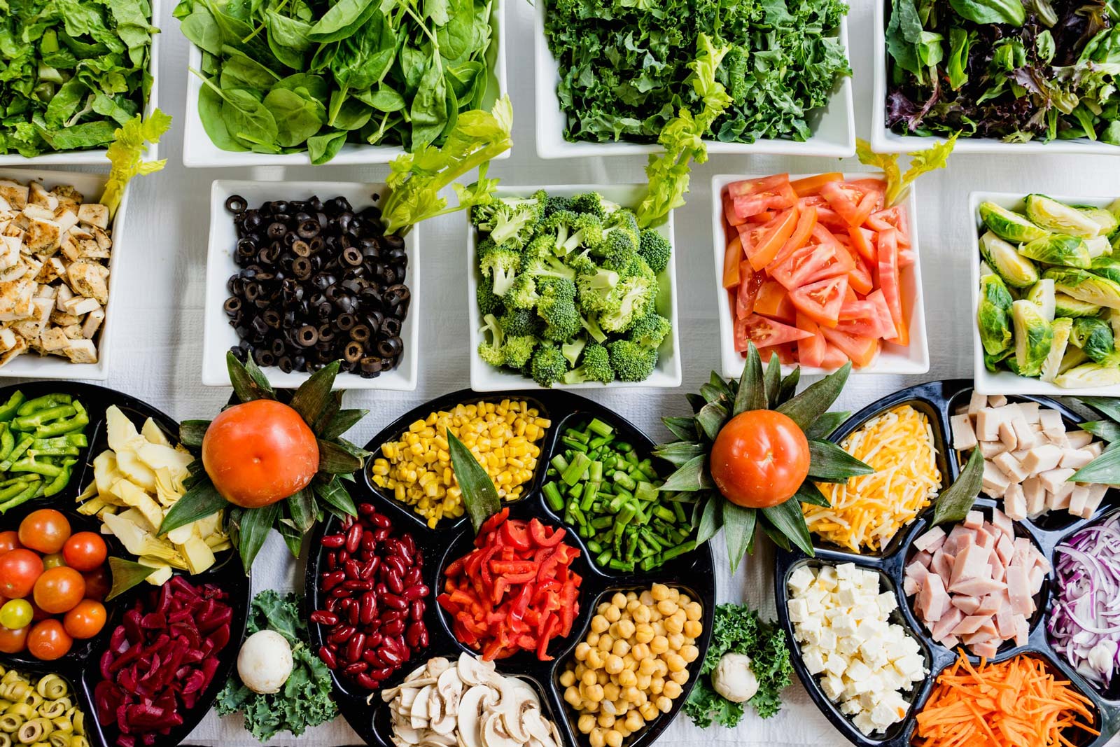 Image of a table full of fruits and vegetables that are good for nutrition